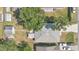 Aerial view of home featuring backyard awning, mature shade trees, and off-street parking at 710 California Ave, St Cloud, FL 34769
