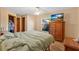 Comfortable bedroom with hardwood floors, a large window and furniture at 710 California Ave, St Cloud, FL 34769