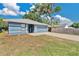 Charming single-story home with a well-manicured lawn and a long driveway at 710 California Ave, St Cloud, FL 34769