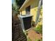 Exterior shot of an AC unit located outside a yellow house at 716 Grove Ave, Orlando, FL 32805