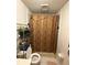 Compact bathroom featuring a tiled shower with a decorative curtain and essential fixtures for convenience at 716 Grove Ave, Orlando, FL 32805