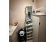 Electrical panel located next to a utility sink and storage cabinets at 716 Grove Ave, Orlando, FL 32805