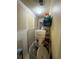 Hallway with paint supplies and a large bucket on top of a cardboard box at 716 Grove Ave, Orlando, FL 32805