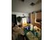 Kitchen with a round table, plenty of counter space, and an ironing board at 716 Grove Ave, Orlando, FL 32805
