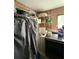 A laundry room with a washer and dryer set as well as overhead storage racks at 716 Grove Ave, Orlando, FL 32805