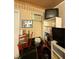 Messy room with a salon chair, television, and other furniture at 716 Grove Ave, Orlando, FL 32805