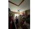 A cluttered storage area with a mini refrigerator, storage bins, and a small window at 716 Grove Ave, Orlando, FL 32805