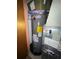 Rheem water heater with an energy guide label in a storage area at 716 Grove Ave, Orlando, FL 32805