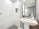 Stylish bathroom featuring a standup shower with marble tiles, a vessel sink, and modern fixtures at 7823 Bell Blvd, Orlando, FL 32810