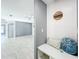 Inviting entryway with marble flooring, custom bench seating, and decorative wall accents at 7823 Bell Blvd, Orlando, FL 32810