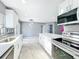 Bright modern kitchen with stainless steel appliances and open floor plan at 7823 Bell Blvd, Orlando, FL 32810