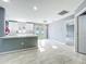 Open-concept living area with marble floors, French doors to yard, and neutral tones at 7823 Bell Blvd, Orlando, FL 32810