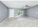 Bright, open living room featuring stylish floors, a modern ceiling fan, and fresh paint at 7823 Bell Blvd, Orlando, FL 32810