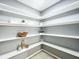 Walk-in pantry with custom shelves offering ample storage for all your cooking essentials at 7823 Bell Blvd, Orlando, FL 32810