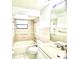 Well-lit bathroom featuring a bathtub, shower, tiled walls, toilet, and sink with large mirror at 849 Long Bay Ct, Kissimmee, FL 34741