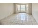 A bright, empty room featuring a bay window and tile flooring at 849 Long Bay Ct, Kissimmee, FL 34741