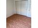 Bedroom offers closet storage and patterned tile flooring at 849 Long Bay Ct, Kissimmee, FL 34741