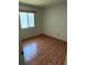 Clean bedroom offers natural light and wood-look tile flooring at 849 Long Bay Ct, Kissimmee, FL 34741