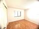 Cozy bedroom with tile flooring, a window, and a closet at 849 Long Bay Ct, Kissimmee, FL 34741