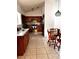 Cozy kitchen with wood cabinetry, granite counters, and stainless appliances at 849 Long Bay Ct, Kissimmee, FL 34741