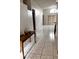 Bright living room features vaulted ceiling and marble tile flooring at 849 Long Bay Ct, Kissimmee, FL 34741