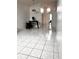 Open living area with neutral walls, tile floor and modern chandeliers at 849 Long Bay Ct, Kissimmee, FL 34741