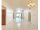 Spacious living room with tile flooring and sliding doors to the outdoor lanai at 849 Long Bay Ct, Kissimmee, FL 34741