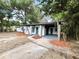 Inviting home with a covered entrance and a spacious driveway at 906 San Domingo Rd, Orlando, FL 32808