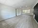 Spacious living room boasting gray wood-look floors, recessed lighting and a large window at 906 San Domingo Rd, Orlando, FL 32808