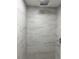 Updated shower with large, modern tiling and a rainfall shower head at 906 San Domingo Rd, Orlando, FL 32808