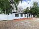 Well-maintained home with a white fence and manicured landscaping at 906 San Domingo Rd, Orlando, FL 32808