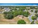 A peaceful neighborhood with well-maintained streets surrounds a cozy home with a wooded lot at 923 Gascony Ct, Kissimmee, FL 34759