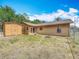 Backyard view with a storage shed, fenced yard, patio area and firepit for outdoor enjoyment at 923 Gascony Ct, Kissimmee, FL 34759