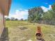 Fenced backyard with a unique outdoor fireplace enhancing the charm of the outdoor living space at 923 Gascony Ct, Kissimmee, FL 34759