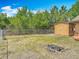 Fenced backyard featuring a storage shed, providing privacy and space for outdoor activities at 923 Gascony Ct, Kissimmee, FL 34759
