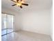 Neutral bedroom with tiled floors and sliding glass doors at 923 Gascony Ct, Kissimmee, FL 34759