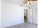 Bright bedroom with tiled flooring leading to an open doorway to the bathroom at 923 Gascony Ct, Kissimmee, FL 34759