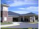 A community clubhouse exterior exhibits a modern design, landscaping, and ample parking at 923 Gascony Ct, Kissimmee, FL 34759