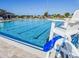 Community pool area featuring a large pool with lanes for swimming and a lifeguard chair at 923 Gascony Ct, Kissimmee, FL 34759