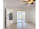 Open-concept room leading into the kitchen and back patio at 923 Gascony Ct, Kissimmee, FL 34759