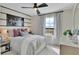 Bedroom with neutral walls, a ceiling fan, and a football theme at 1058 Cloud Ridge Ct, Mount Dora, FL 32757