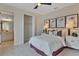 Bright bedroom featuring a view into an ensuite bathroom and walk-in closet at 1058 Cloud Ridge Ct, Mount Dora, FL 32757