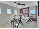 Bedroom with a dark accent wall and bright natural light at 1058 Cloud Ridge Ct, Mount Dora, FL 32757