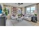 Inviting living room featuring comfortable seating, stylish decor, and large windows at 1058 Cloud Ridge Ct, Mount Dora, FL 32757