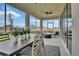 Screened patio with modern dining set and comfortable lounge area to enjoy the outdoor living at 1058 Cloud Ridge Ct, Mount Dora, FL 32757