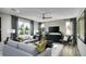Bright living room with comfortable seating, contemporary decor, and large windows offering scenic views at 1066 Cloud Ridge Ct, Mount Dora, FL 32757