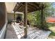 Back patio with pergola, barbecue and concrete slab in need of repair at 1100 Anne Elisa Cir, St Cloud, FL 34772