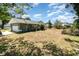 Expansive backyard showcasing the property's size, complemented by lush greenery and mature trees at 1100 Anne Elisa Cir, St Cloud, FL 34772