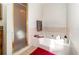 Bathroom showcasing a shower with glass doors and a soaking tub at 1100 Anne Elisa Cir, St Cloud, FL 34772