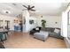 Open-concept living space flowing into a dining area, featuring tile flooring and modern decor at 1100 Anne Elisa Cir, St Cloud, FL 34772